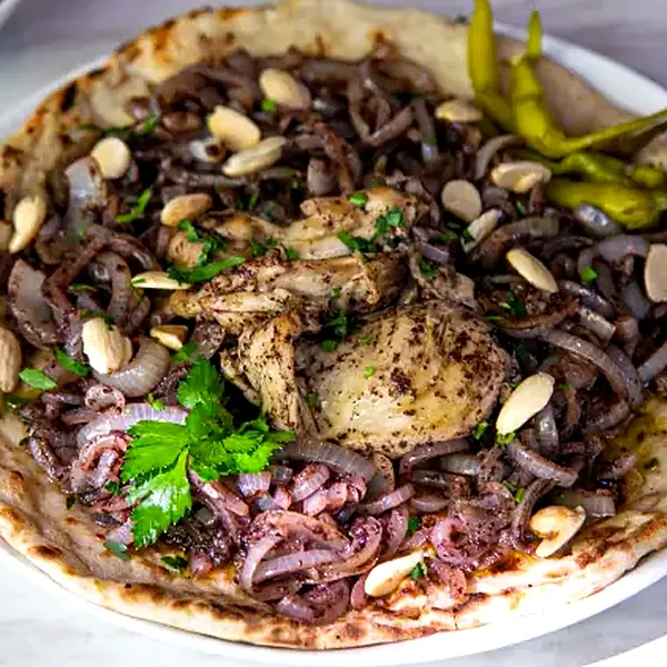 Musakhan, sumac chicken and onion on taboon bread